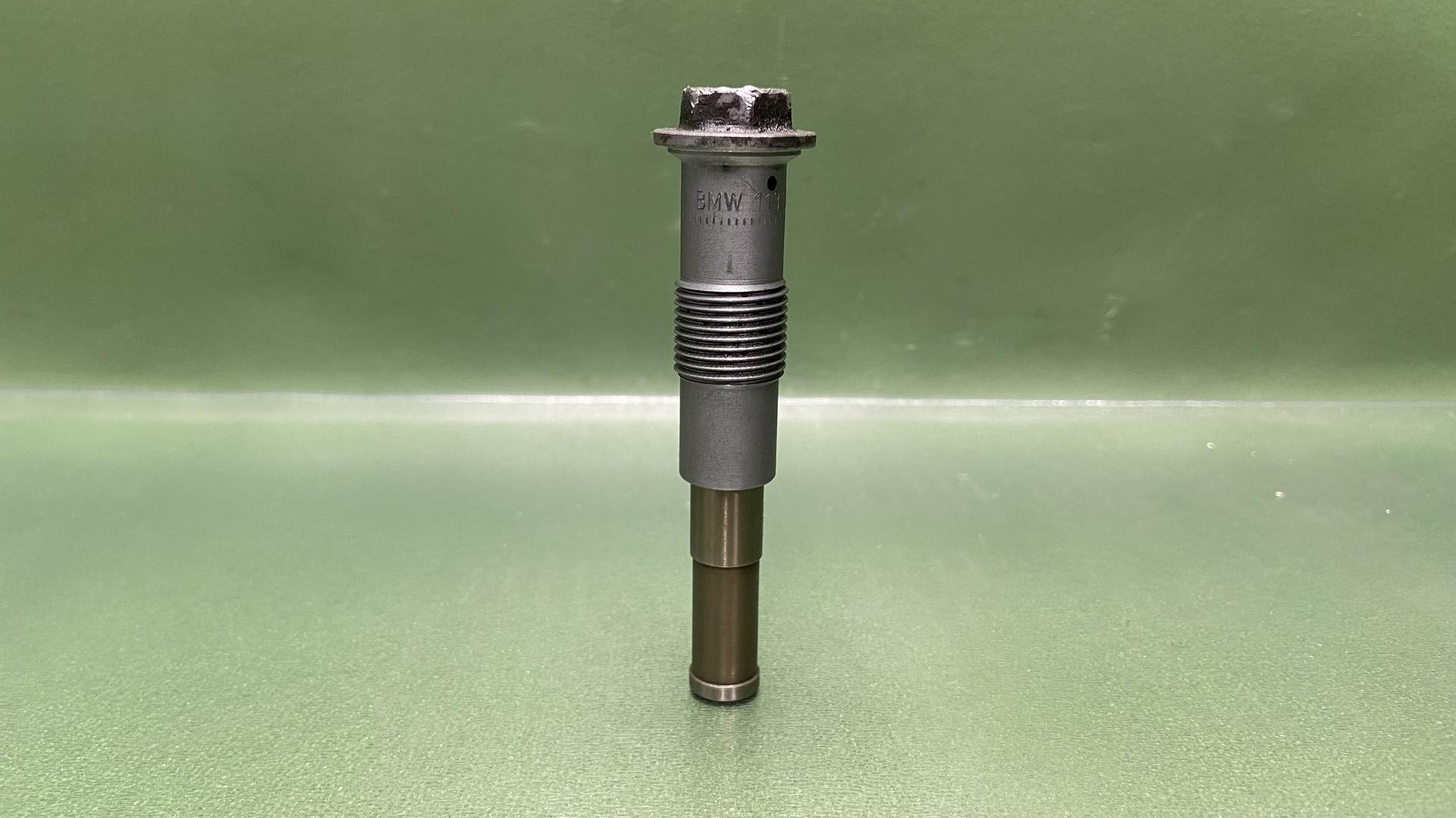 Натяжитель цепи левый 11317707797